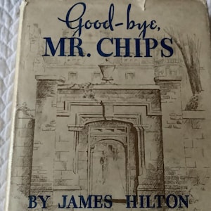 May include: A vintage book cover with a black and white illustration of a building with an arched doorway. The text on the cover reads "Good-bye, MR. CHIPS" and "BY JAMES HILTON".