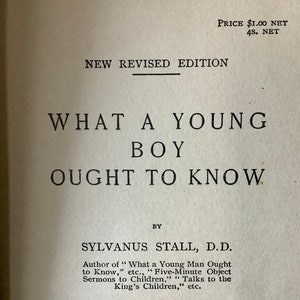 May include: An open book with the title "WHAT A YOUNG BOY OUGHT TO KNOW" in large, bold, black letters. The author's name, Sylvanus Stall, D.D., is below the title. The words "NEW REVISED EDITION" are at the top.