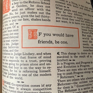 May include: A black and white image of a book page with text that reads "If you would have friends, be one." The text is in a bold, serif font and is surrounded by a decorative border.