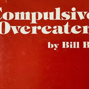 May include: A red book cover with the title "Compulsive Overeater" in white text and the author "by Bill B." in white text below.