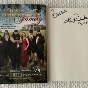 SIGNED By Kay Robertson/Duck Dynasty/ The Duck Commander Family/Chapters Built Around Recipes/Willie & Korie Robertson/261 pg Hardcover