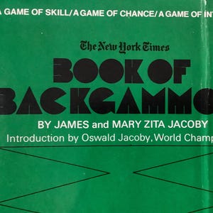 May include: A green book cover with the title "BOOK OF BACKGAMMON" in large black letters. The book is by James and Mary Zita Jacoby, with an introduction by Oswald Jacoby. The New York Times logo is at the top.