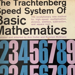 May include: Book cover for "The Trachtenberg Speed System Of Basic Mathematics." The title is in large black letters, with the subtitle in smaller text. Below, large blue and pink numbers are displayed.