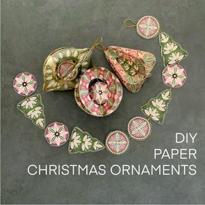 May include: DIY paper Christmas ornaments in various shapes and colors. The ornaments include a round, a teardrop, and a cone shape, along with a garland of circles and Christmas trees. The ornaments are decorated with floral patterns in pink, green, and white.