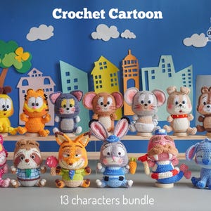 May include: A collection of 13 crocheted cartoon characters, including a yellow cat, orange tiger, and gray mouse. The characters are displayed on a wooden shelf against a blue backdrop with paper cutouts. The text "Crochet Cartoon" and "13 characters bundle" are visible.