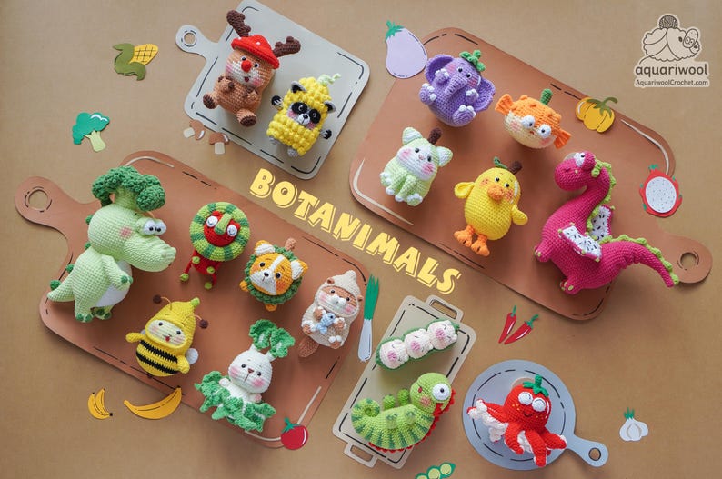 May include: A collection of colorful, crocheted "Botananimals" arranged on wooden cutting boards. The collection includes a variety of animal-vegetable hybrids, such as a broccoli dinosaur, a bee in a banana costume, and a tomato octopus. The word "Botananimals" is displayed.