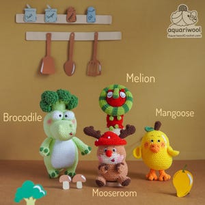 May include: A collection of handmade crochet toys, including a green crocodile with broccoli, a watermelon-themed character, a reindeer, and a yellow chick. The toys are displayed with wooden kitchen utensils and spice jars.