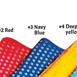 May include: Fabric samples in various colors, including black, red, navy blue, deep yellow, and sky blue. Each fabric has a repeating floral pattern. The text "Flower Pattern" is at the top.