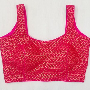 Hot pink fashionable saree blouse , sequins wedding blouse , readymade saree blouse women's clothing , sleeveless padded blouse .
