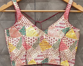 multi color pretty heavy embroidered work and sequins work saree blouse . ready made fashionable designer blouse / crop top .(base : White)