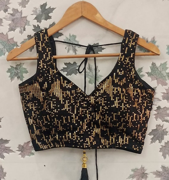 black top with gold sequins