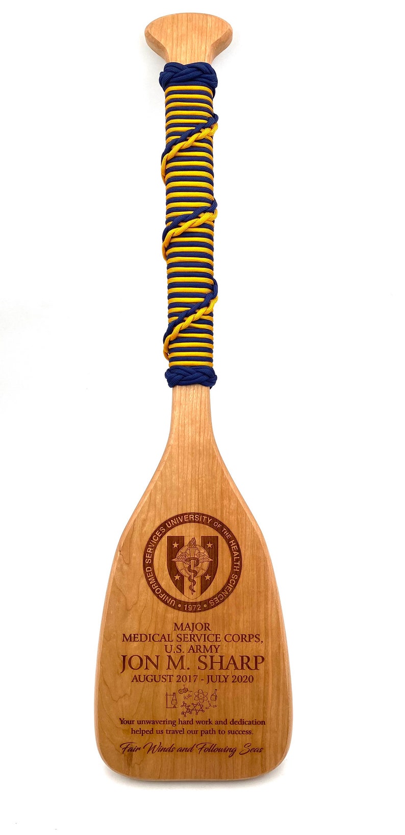 Military paddle made of top grade cherry wood with custom laser engraving.  Navy, USCG, Marines, Air Force, Army, Joint Chiefs, any logo you would like.  Price includes all front side engraving and paracord wrap plus free shipping.