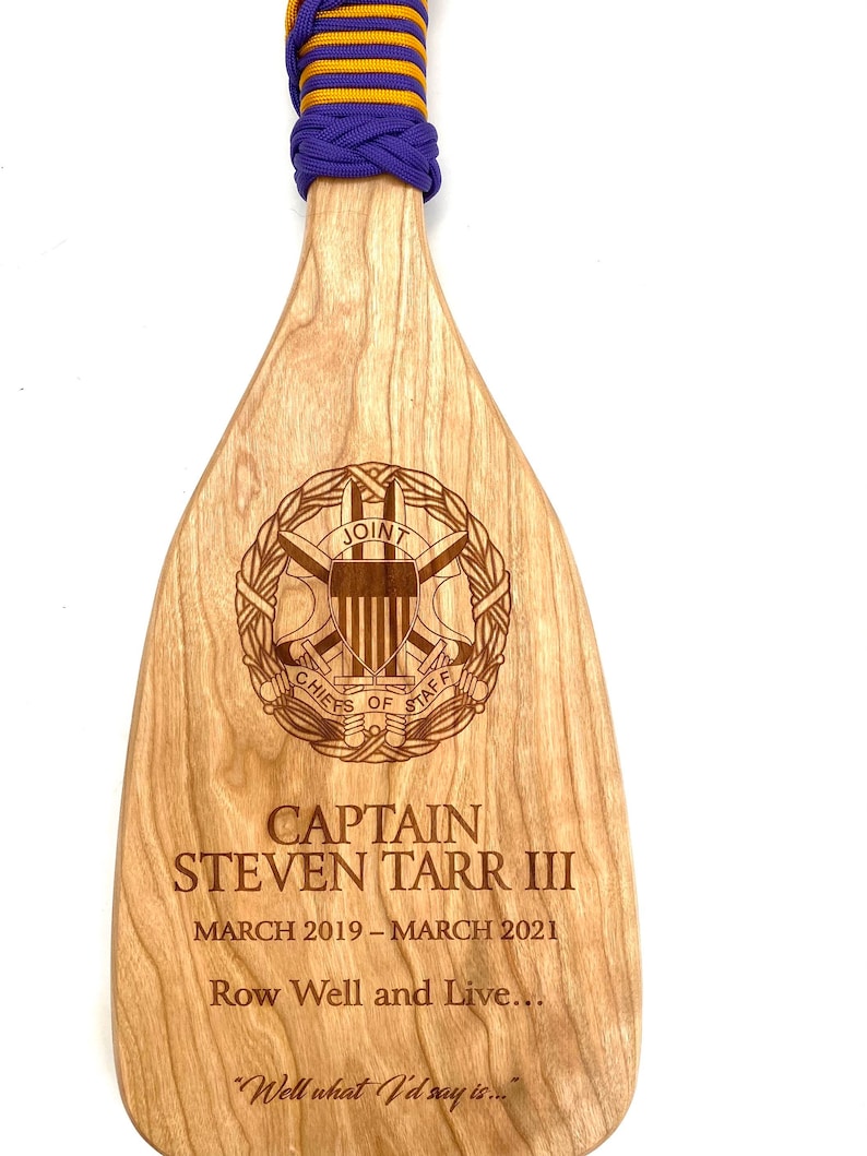 Military paddle made of top grade cherry wood with custom laser engraving.  Navy, USCG, Marines, Air Force, Army, Joint Chiefs, any logo you would like.  Price includes all front side engraving and paracord wrap plus free shipping.
