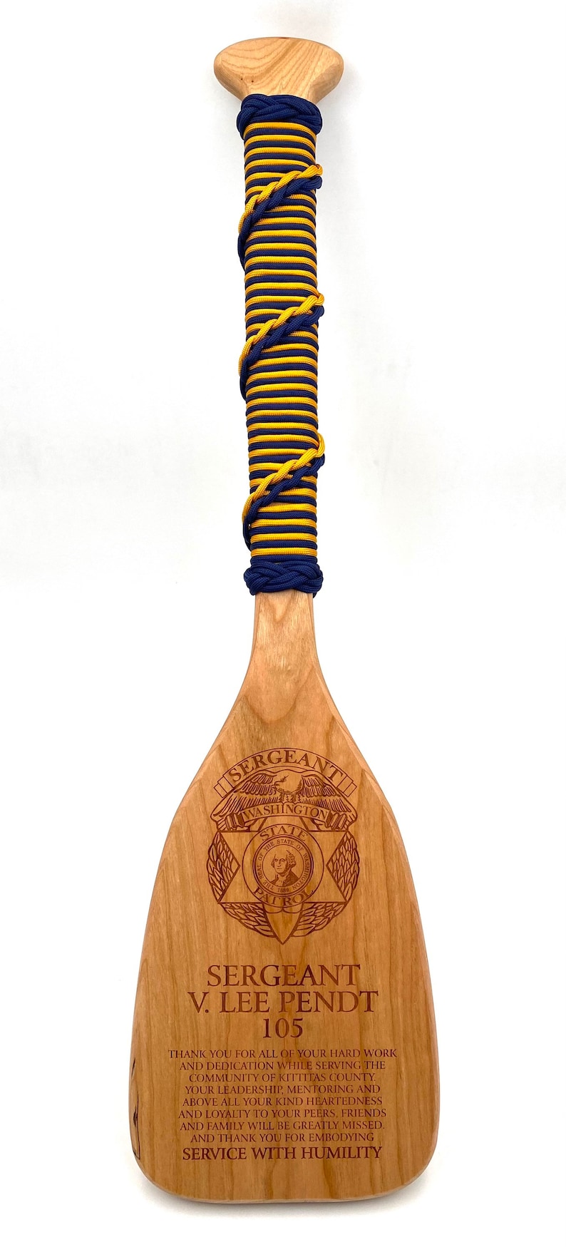 Military paddle made of top grade cherry wood with custom laser engraving.  Navy, USCG, Marines, Air Force, Army, Joint Chiefs, any logo you would like.  Price includes all front side engraving and paracord wrap plus free shipping.