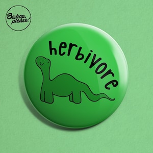 May include: Green button with a black outline of a dinosaur and the text "herbivore" in black.