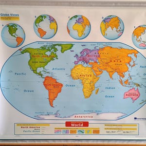 May include: A colorful world map with continents labeled in various colors. Five smaller globes are displayed at the top. The map includes oceans, continents, and the text "World" at the bottom. The map is on a roll-up poster.