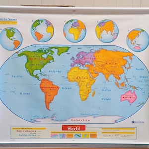 May include: A colorful world map with continents outlined in different colors, including North America, South America, Europe, Asia, Africa, and Australia. The map also includes the Arctic Ocean, Pacific Ocean, Atlantic Ocean, Indian Ocean, and Southern Ocean. The map is labeled "World" and includes the text "Globe Views" at the top.