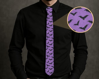 May include: A purple tie with a repeating pattern of black bats. The tie is worn with a black button-down shirt. A close-up shows the bat pattern on a purple background. The tie is a Halloween-themed accessory.