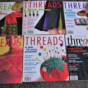 May include: Six different issues of Threads magazine, a publication for sewing enthusiasts. The covers feature various sewing projects, including a velvet scarf, kick pleats, stylish belts, a 3-hour scarf, a pincushion, and a Chanel jacket.