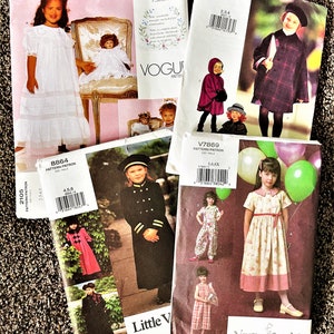May include: Five different sewing patterns for children's clothing. The patterns are Vogue, Little Vogue, and Vogue for Me. The patterns include a plaid coat, a dress with a bow, a dress with a ruffle, a dress with a Peter Pan collar, and a dress with a sailor collar.