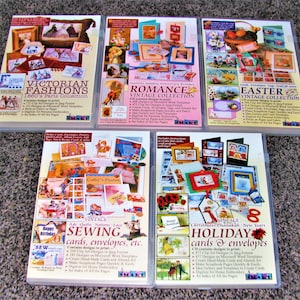 May include: Five DVD cases with colorful images and text. The titles are "Victorian Fashions 1860's Paris Collection", "Romance Vintage Collection", "Easter Vintage Collection", "Vintage Sewing Cards, Envelopes, etc.", and "Holiday Cards & Envelopes".