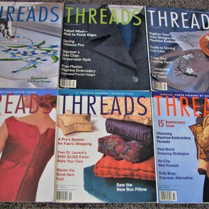 May include: A collection of eight Threads magazine issues featuring various sewing and embroidery projects. The covers showcase different techniques, including hand-sewn zippers, free-motion embroidery, and quilting on silk.