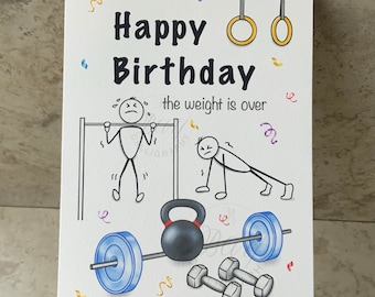 May include: A humorous birthday card featuring a stick figure illustration of a person struggling to do a pull-up and another stick figure doing a push-up. The card includes the text "Happy Birthday the weight is over".