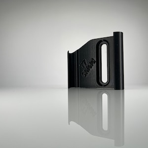 May include: A black plastic camera accessory with the text "T7 Shield" printed on it.