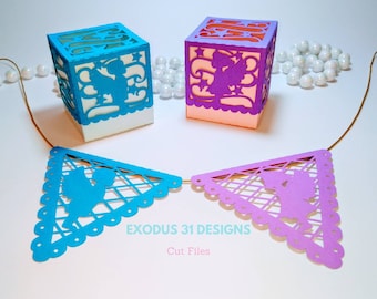 May include: Two papercraft boxes with a cut-out design of angels. The boxes are white and pink with a light blue and purple angel design. A string of white pearls and a blue and purple paper banner with a cut-out design of angels are also shown.