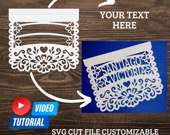 May include: White, laser-cut paper banner with floral and heart designs. The banner includes the text "SANTIAGO & VICTORIA" and the words "YOUR TEXT HERE". The image also includes a video tutorial icon and the text "SVG CUT FILE CUSTOMIZABLE TALAVERA INSPIRED BANNER".