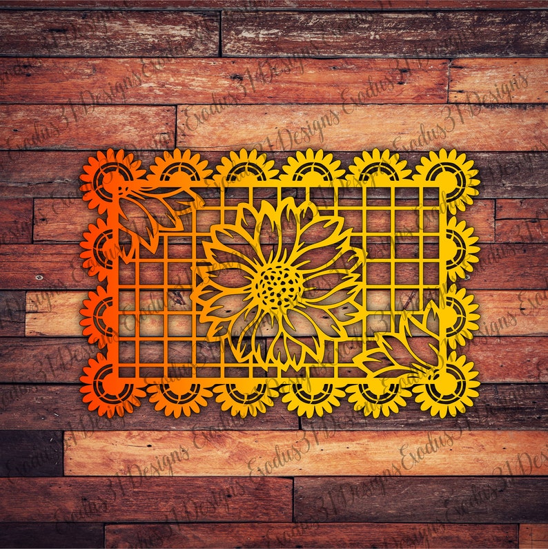 Puede incluir: Un recorte de papel amarillo y naranja de un girasol con un borde decorativo. El recorte tiene forma de cuadrado y tiene un patr&oacute;n de cuadr&iacute;cula en el interior.