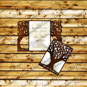 May include: Brown laser-cut wedding invitation with a tree design. The invitation includes the names of the couple, the date, and the location of the wedding. The invitation is set against a wooden background.