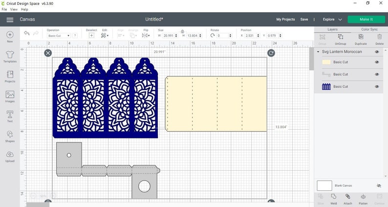 May include: A Cricut Design Space screen showing a design for a Moroccan lantern. The design is made up of three blue panels with intricate cut-out patterns and a beige panel with score lines. The design is 20.597 inches wide and 13.804 inches tall.