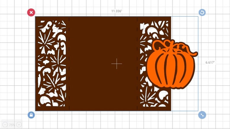 May include: A brown card with a cut-out design of leaves and vines. A large orange pumpkin with a stem and leaves is cut out and attached to the right side of the card.