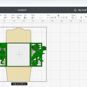 May include: A digital design for a green dinosaur-themed gate fold card with a square opening in the center. The design is shown on a computer screen with a grid background. The design is labeled "Svg Gate Fold T-rex" and "Svg Envelope 5.2x5.2".