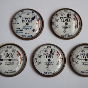 May include: Five round, white, metal gauges with black needles and red markings. The gauges are labeled "Power Boost", "Power Level", and "Power Level". The gauges are made in England.