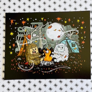 May include: A digital illustration of two furry creatures, one brown and one white, sitting around a campfire with a marshmallow on a stick. The background is a dark forest with stars and trees.