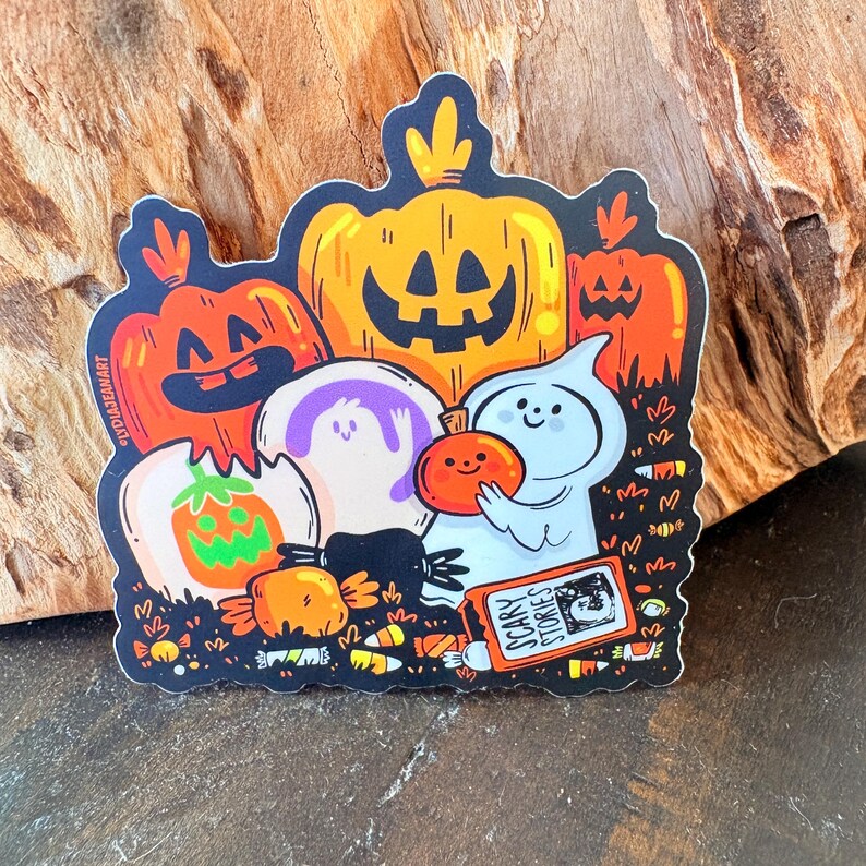 May include: A Halloween-themed sticker featuring cartoon pumpkins, ghosts, and candy. The pumpkins are orange and yellow with carved faces. A blue ghost holds a small pumpkin. The sticker includes the text "Scary Stories".