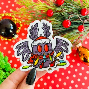 Feestelijke vinylsticker Mothman | | Cryptiden | Leuke cryptid | Cryptozoölogie | Leuke sticker motman | Mothman-cadeau | Kerstvlinder