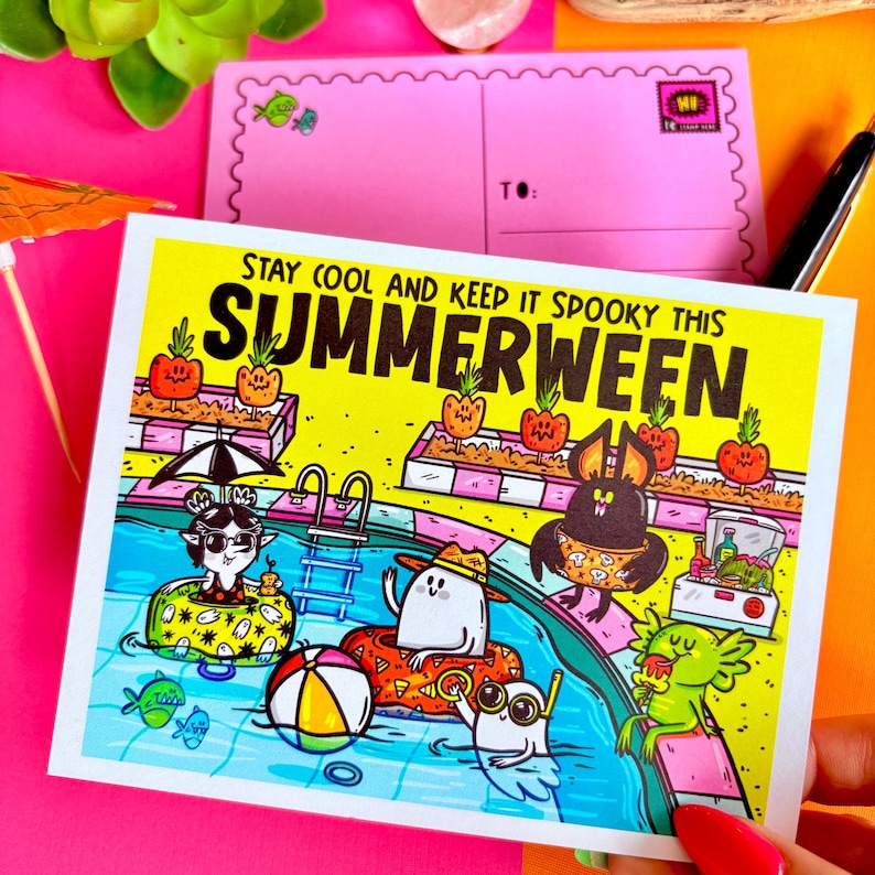 May include: A colorful illustration on a postcard with the text "Stay Cool and Keep it Spooky This Summerween." The image depicts cartoon characters in a swimming pool, with a beach ball and floating devices. A pink postcard is in the background.