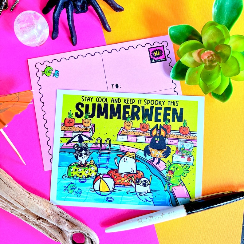 May include: A colorful postcard with the text "STAY COOL AND KEEP IT SPOOKY THIS SUMMERWEEN" featuring cartoon characters in a swimming pool. A pink postcard and a black marker are also in the image.