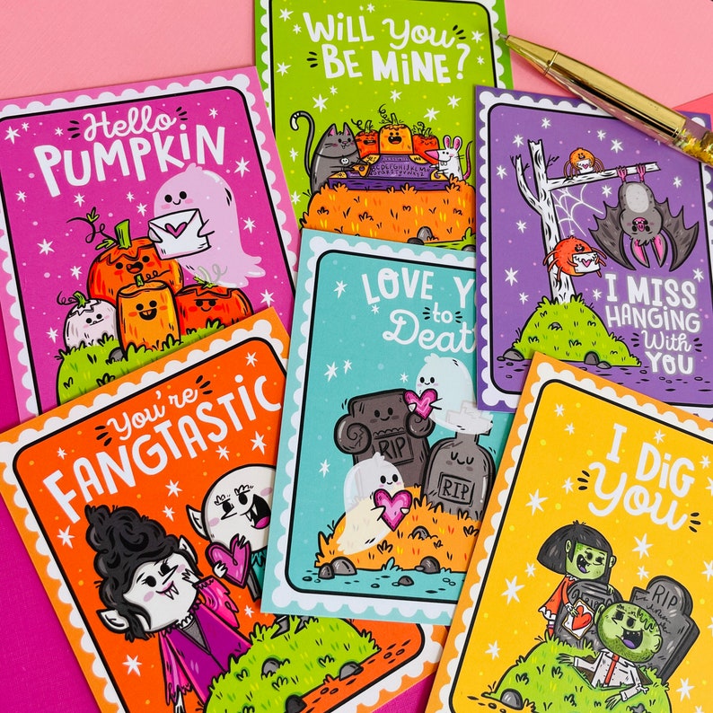 May include: A collection of Halloween-themed greeting cards with various illustrations and phrases. The cards feature images of pumpkins, ghosts, bats, and zombies. Phrases include "Hello Pumpkin," "Will You Be Mine?" and "I Dig You."