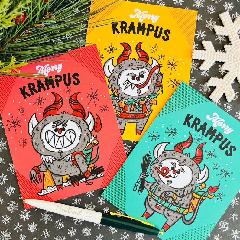 May include: Three Christmas cards featuring a cartoon Krampus with the text "Merry Krampus". Each card has a different colored background: red, yellow, and teal.