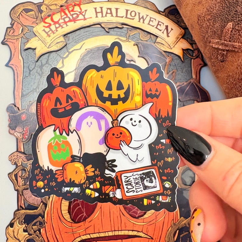 May include: A Halloween-themed sticker featuring cartoon pumpkins, ghosts, and candy. The sticker has the words "Scary Happy Halloween" at the top and "Scary Stories" on a book. The color palette includes orange, purple, white, and black.