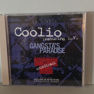 May include: A CD single by Coolio featuring L.V. titled "Gangsta's Paradise" from the soundtrack of the movie "Dangerous Minds".