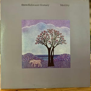 May include: Album cover art for "Motility" by Steve Kuhn and Ecstasy. The artwork features a tree with pink flowers, a white animal, and a landscape in shades of purple and blue. The album title and artist are at the top.