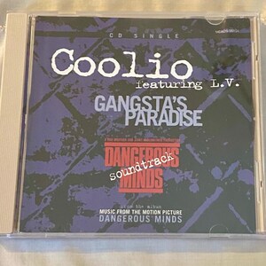 May include: A CD single of Coolio featuring L.V. for the song "Gangsta's Paradise" from the "Dangerous Minds" soundtrack. The CD case is clear with a white spine. The album art features a purple and black background with white and red text.