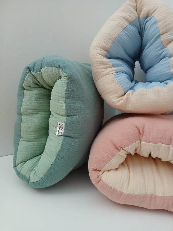 organic mini nursing pillow for on the go, all natural arm slip on cushion for baby feeding, compact travel pillow for breastfeeding support