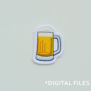 May include: Embroidered patch featuring a cartoon beer mug filled with golden beer and white foam. The mug has a blue handle and is outlined in white. The text "*DIGITAL FILES" is at the bottom.