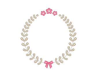May include: A wreath of beige leaves with three pink flowers and a pink bow at the bottom.